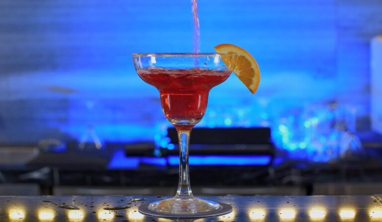 Close-up of a refreshing red cocktail in a margarita glass